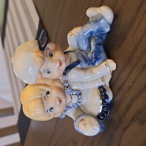 Vintage Porcelain Figurine of a Boy and Girl